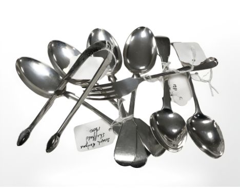 A pair of Georgian silver sugar tongs, Newcastle marks, a set of four silver dessert spoons, Joseph Rodgers, Sheffield 1900, 