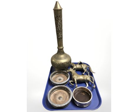 A tall pierced brass candle shade/incense stick holder, two brass figures of horses and three silver plated bottle coasters 