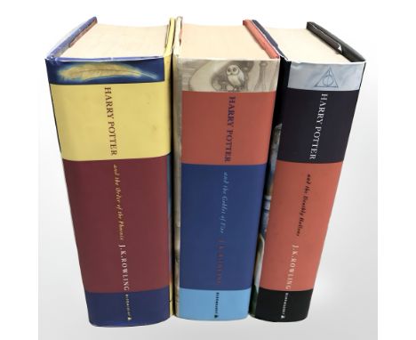 Three first edition Harry Potter books.