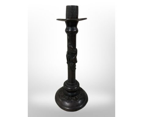 A Chinese bronze candlestick, height 25cm.