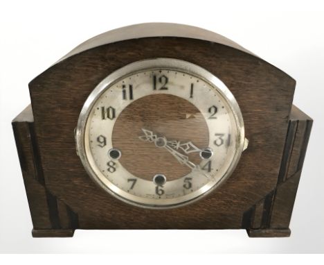 An Art Deco oak eight day mantle clock, height 22 cm.