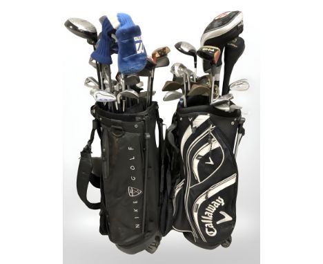 Two golf bags containing assorted irons and drivers, including Dunlop, Instinct, Mizuno, Cleveland, etc.