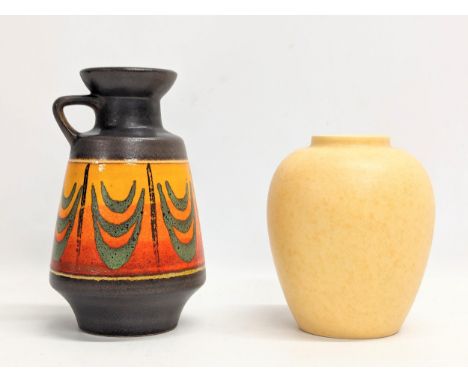 A Mid Century West German vase and a Poole Pottery vase. Tallest measures 21cm 