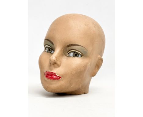 A vintage fibreglass head with detailed glass eyes. 21x22cm 