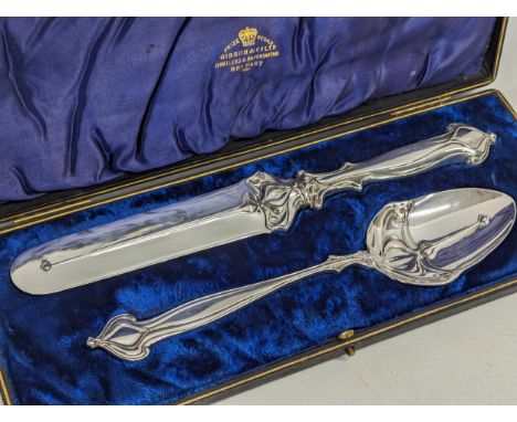 A vintage Art Nouveau style serving spoon and cake slice in case. Marked L&amp;W S. 