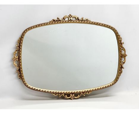A good quality vintage brass framed mirror. 72x52cm 