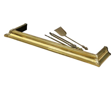 A vintage brass fender with fire tools. Exterior 142cm. Interior 122cm 