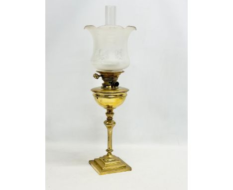 A good quality late Victorian brass oil lamp by Evered &amp; Co LTD, London. With later shade. 65cm 