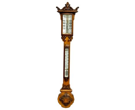 A large Victorian oak stick barometer by F.M. Moore of Belfast and Dublin. 107cm 