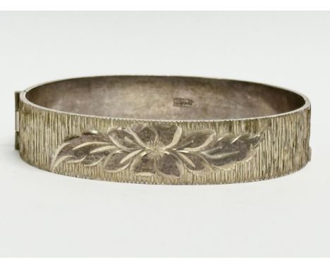 A vintage sterling silver bangle by B LTD. Birmingham. 28.72 grams. 6x5.5cm closed. 