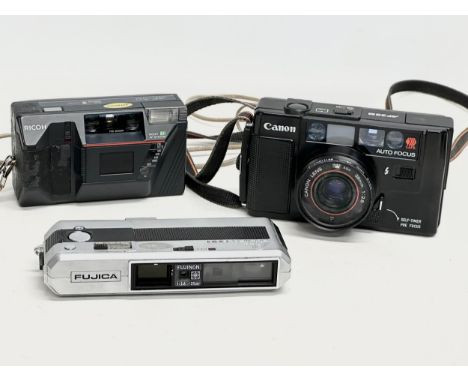 3 vintage cameras. A Canon AF35M. A Ricoh AF-50. Pocket Fujica 600. 