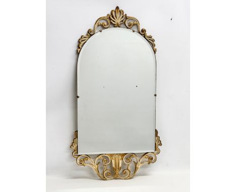 A vintage ornate gilt framed bevelled mirror. 45x84cm 