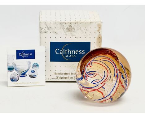 A Caithness Golden Jubilee Celebtration Art Glass paperweight with box. Paperweight measures 8.5x8.5cm 