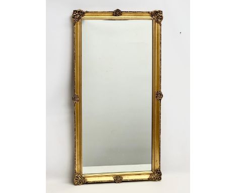 A good quality vintage ornate gilt framed mirror. 46x86cm 