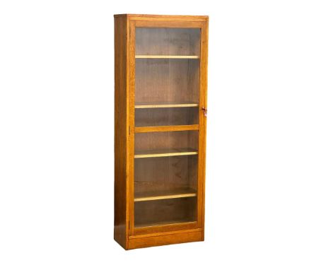 A large vintage oak glazed door cabinet with adjustable shelves. 69x32x84cm 