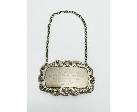 A silver decanter label. Presented to Wor. Bro. J.J.Brown by Abercorn Masonic Lodge. Birmingham. 12.65 grams. 