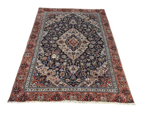 A very large vintage Middle Eastern hand knotted rug.  316x223cm 