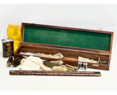 A vintage gun cleaning kit. 