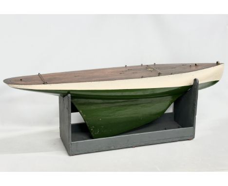 A large good quality vintage model yacht on stand. Yacht measures 135x29x41.5cm 
