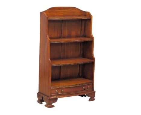 A mahogany step front bookcase with drawer on bracket feet.  60x25x107cm 