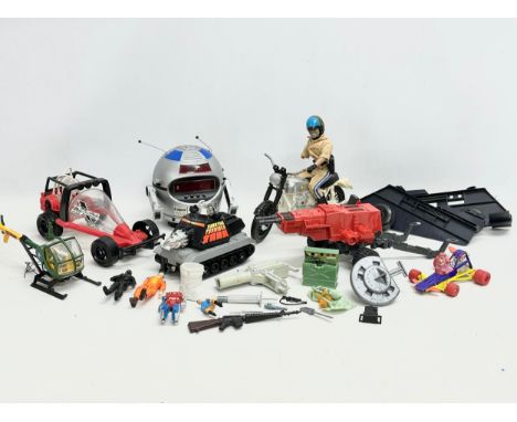 A collection of vintage toys and parts. A Chips police man on motorcycle. A 1982 Hasbro GI Joe Laser Exterminator. A 1979 Bri