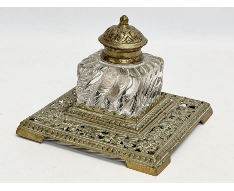 A large Victorian ornate pierced brass inkwell. 17x17x12cm 