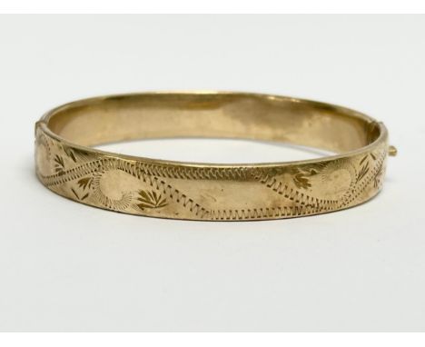 A vintage rolled gold bangle. 