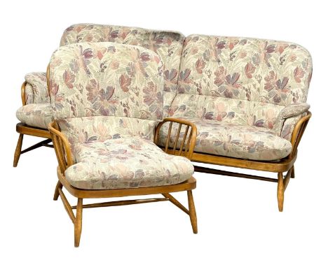 A 2 piece Ercol ‘Jubilee’ Mid Century elm suite. 3 seater and an armchair. 