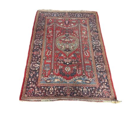 A vintage Middle Easter hand knotted rug, 206cm x 138cm 