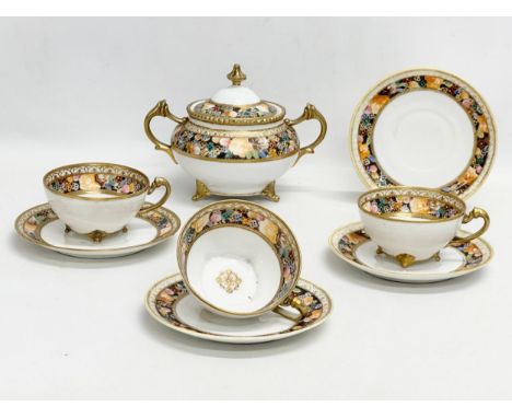 An early 20th century Japanese hand painted porcelain part tea service by Noritake. 