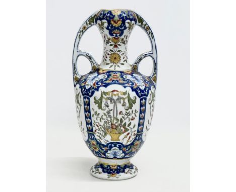 A late 19th century North European hand painted ceramic pot with 2 handles. 16x32cm 