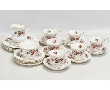 A 23 piece Royal Albert ‘Lavender Rose’ tea service. 4 salad plates, milk jug, sugar bowl, 5 sandwich plates, 6 cups and 6 sa