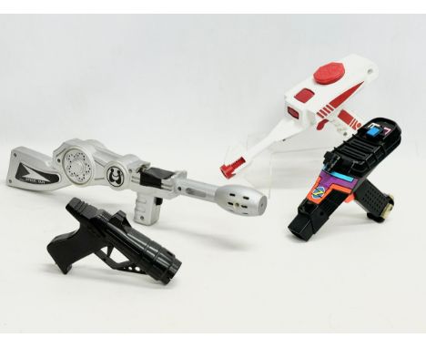 4 vintage toy guns. A 1970’s Lone Star Cosmic Jet Stream water ray gun 32cm. A Star Blazer Phazer Guns gaming gun. A vintage 