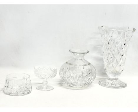 4 pieces of Waterford Crystal. A large Waterford crystal vase 16.5x25.5cm. A Waterford lamp shade 16x16cm. A Waterford champa