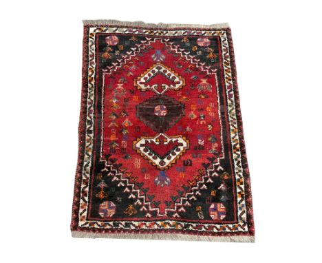A vintage Iranian hand knotted rug. The Persian Rug Company. 83x121cm 