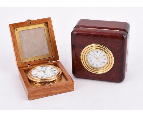 
	
		ASPREY
		A LACQUERED AND GILT METAL TRAVEL ALARM DESK CLOCK
		Movement: Quartz alarm
		Case: Gilt metal case mounted in 