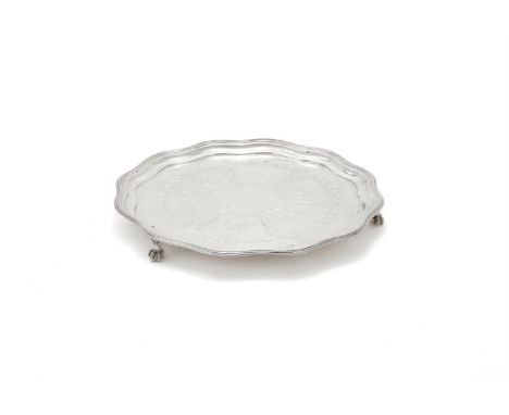 
	
		AN EDWARDIAN SILVER SHAPED CIRCULAR SALVER
		JAMES DEAKIN &amp; SONS, SHEFFIELD 1903
		With a beaded border, engraved de