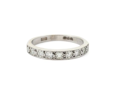 
	
		A DIAMOND NINE STONE HALF ETERNITY RING 
		LONDON 1968 
		The 18 carat white gold band set with eight cut diamonds, appr