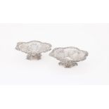 A PAIR OF VICTORIAN SILVER SHAPED CIRCULAR PIERCED BASKETS