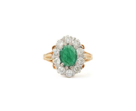 
	
		A DIAMOND AND EMERALD CLUSTER RING 
		LONDON 1986 
		The oval cut emerald within a surround of brilliant cut diamonds ap