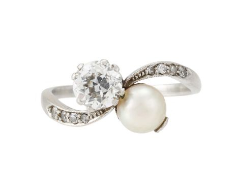 
	
		AN EARLY 20TH CENTURY PEARL AND DIAMOND TOI ET MOI RING 
		The old European cut diamond estimated to weigh 0.75 carats, 