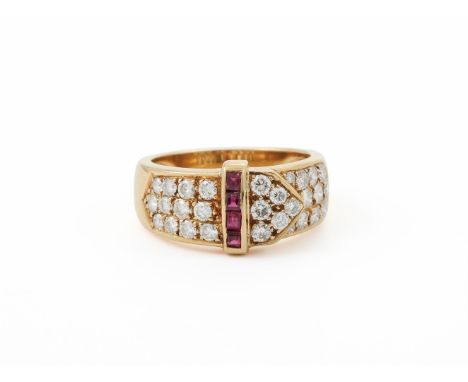 
	
		AN 18 CARAT GOLD, RUBY AND DIAMOND BUCKLE RING 
		LONDON 1989
		The pav&#233; set brilliant cut diamonds on a slightly t