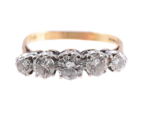 
	
		A FIVE STONE DIAMOND RING 
		LONDON 1975
		The five brilliant cut diamonds in claw settings, approximately 1.25 carats t