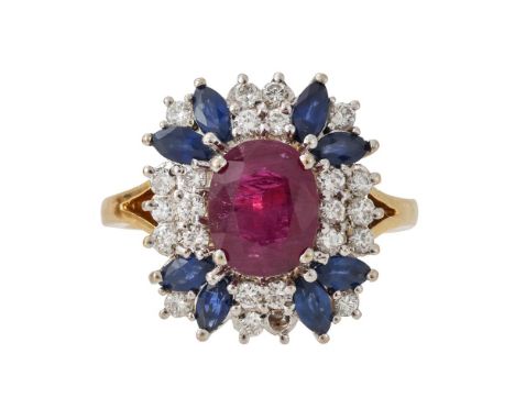 
	
		A RUBY, SAPPHIRE AND DIAMOND CLUSTER RING 
		LONDON 1994
		The oval cut ruby within a four claw setting within a surroun