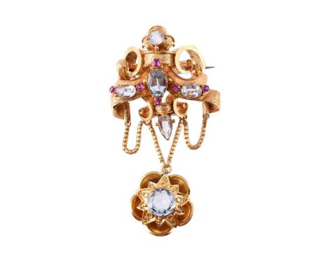 
	
		A VICTORIAN RUBY AND AQUAMARINE BROOCH 
		The scrolled surmount set with oval cut aquamarines with oval cut rubies, with