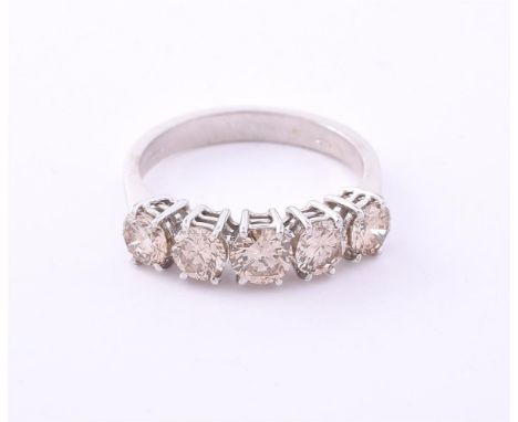 
	
		A BROWN DIAMOND FIVE STONE DIAMOND RING 
		SHEFFIELD 2003
		The brown tinted brilliant cut diamonds, approximately 1.50 