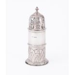 AN EDWARDIAN SILVER LIGHT HOUSE SUGAR CASTER