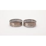 A PAIR OF GEORGE III SILVER WINE COASTERS