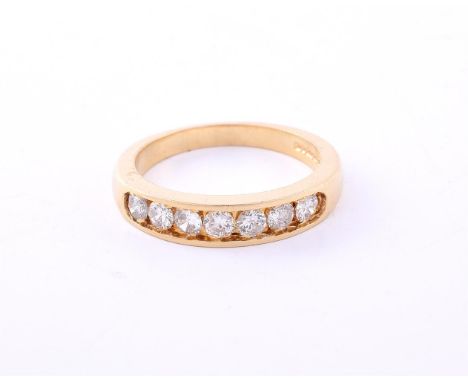 
	
		A DIAMOND HALF ETERNITY RING 
		LONDON 1996
		The brilliant cut diamonds in a channel setting, approximately 0.56 carats
