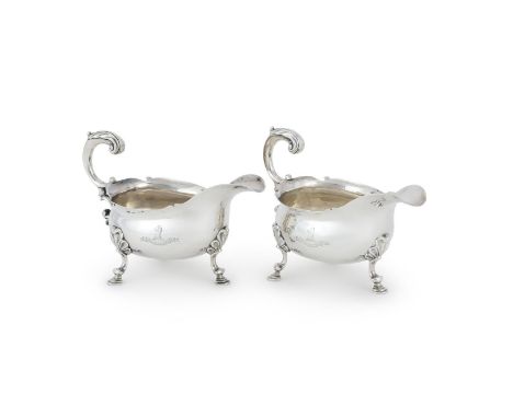 
	
		A PAIR OF GEORGE II SILVER OVAL SAUCE BOATS
		MAKER&#39;S MARKS OBSCURED, LONDON 1750
		With leaf capped flying scroll h
